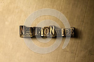 NATIONWIDE - close-up of grungy vintage typeset word on metal backdrop