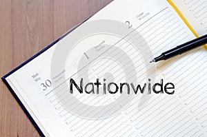 Nationwide write on notebook photo