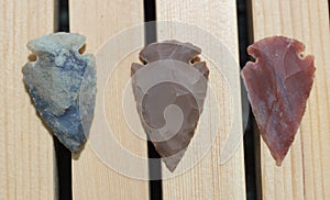 Native American Arrowhead Collection on Wooden Background