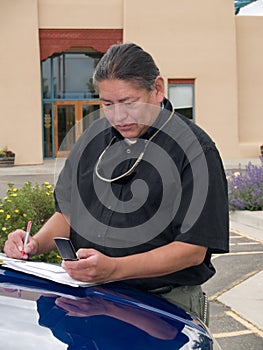 Native American man calling on cell phone