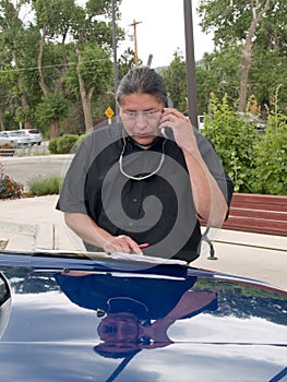 Native American man talking on cell phone