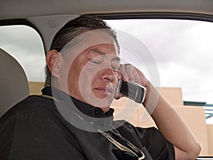 Native American man talking on cell phone