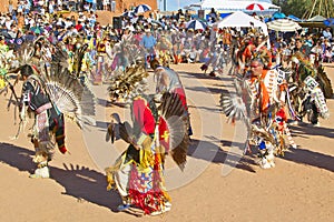 Native Americans in full regalia dancing