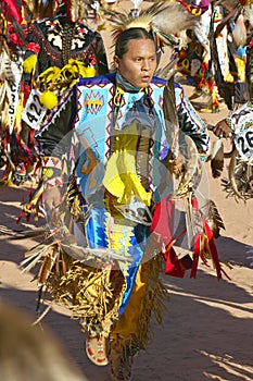 Native Americans in full regalia dancing at Pow wow