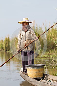 The native fisherman started working early in the boat in the morning in Thailand