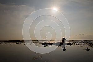 The native fisherman started working early in the boat in the morning in Thailand