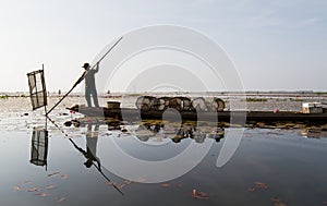 The native fisherman started working early in the boat in the morning in Thailand