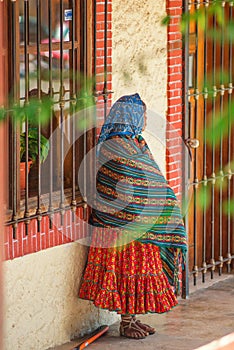 Native Indigenous old lady in colorful traditional dress, in Mexico, America