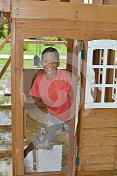 Native Nicaragua boy plays child's playhouse in Corn Island,Nic