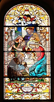 Nativity Scene, Adoration of the Shepherds, stained glass window in the Saint John the Baptist church in Zagreb, Croatia