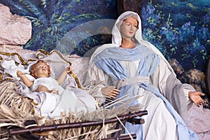 Nativity scene - beautiful statues of the Virgin Mary and baby Jesus in a manger. Christmas holiday