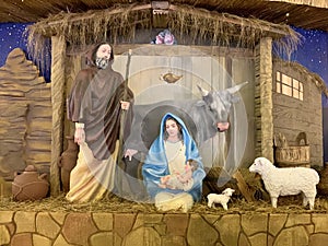 Nativity scene - Christ Born, Mary and Joseph. Street decoration on the eve of Christmas. The scene of the birth of Jesus with