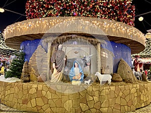 Nativity scene - Christ Born, Mary and Joseph. Street decoration on the eve of Christmas. The scene of the birth of Jesus with