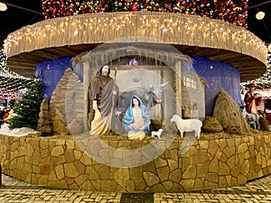 Nativity scene - Christ Born, Mary and Joseph. Street decoration on the eve of Christmas. The scene of the birth of Jesus with