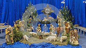 Christmas nativity scene with baby Jesus, Mary and Joseph in the manger with sheeps. Christmas event