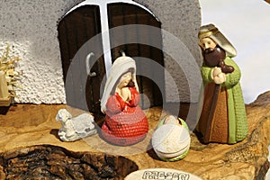 nativity scene with the holy family with a ceramic sheep