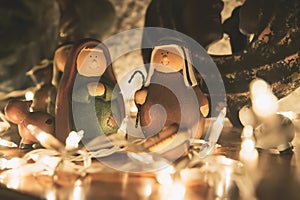 Nativity Scene wooden background and christmas lights