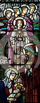 The Nativity in stained glass (birth of Jesus). Mary holding Jesus.