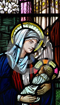 The Nativity in stained glass (birth of Jesus). Mary holding Jesus.