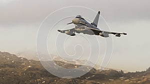NATO military jet fighter on a low level patrol sortie photo
