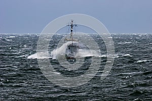 NATO military ship at sea during a storm