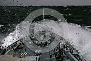 NATO military ship at sea during a storm