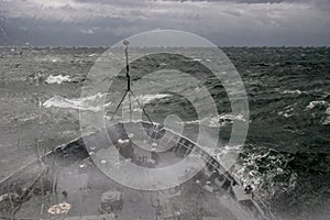 NATO military ship at sea during a storm