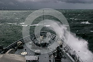 NATO military ship at sea during a storm photo