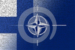 NATO-OTAN. Finland. NATO flag. Finland flag. Flag with the NATO logo. Concept of annexation of Finland with NATO-OTAN. Foreground.