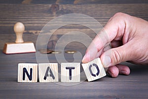 Nato from wooden letters on wooden background