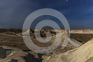 Natt over Ustyurt Plateau. District of Boszhir. The bottom of a dry ocean Tethys. Rocky remnants. Kazakhstan. selective focus.