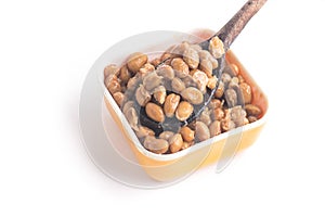 Natto. Fermented soybeans into a spoon