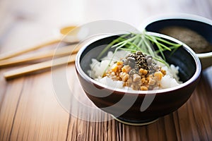 natto garnished with seaweed and sesame seeds