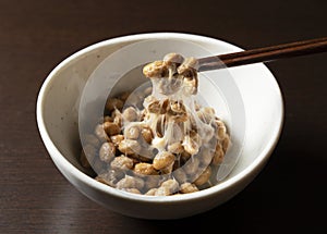 Natto placed against a dark wooden background