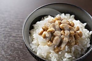 Natto and rice set against a dark wooden background