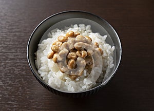 Natto and rice set against a dark wooden background