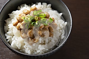 Natto and rice set against a dark wooden background