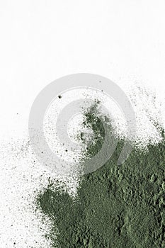 natural additives and superfood. green spirulina algae powder on white background. healthy lifestyle concept.