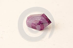 Natural amethyst stone on light background. Natural stones, crystals for magic, lithotherapy, geology, minerals, stone collection