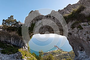 Natural arch called Ojo del Diablo in Cantabria, Spain