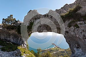 Natural arch called Ojo del Diablo in Cantabria, Spain photo