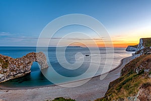 The natural arch Durdle Door after sunset