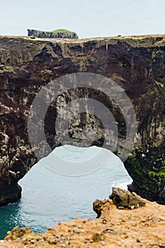 natural arch in Dyrholaey promontory in Iceland