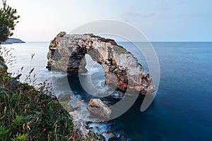 Natural arch Es Pontas in Santanyi, Majorca, Spain at blue hourEs Pontas in Santanyi, Majorca, Spain at blue hour photo