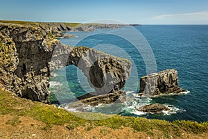The natural arch know as the Green Bridge of Wales together with surrounding stacks on the Pembrokeshire coast