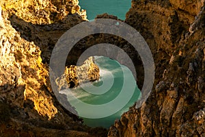 Natural arch at Ponta da Piedade in the evening light