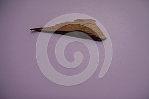 Natural aromatic incense sandalwood isolated on a pink background photo