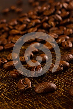 Natural background for Cafe menu or brochure template - macro photo of brown roasted coffee beans, close up