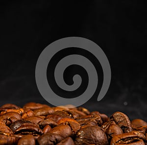 Natural background for Cafe menu or brochure template - macro photo of brown roasted coffee beans, close up