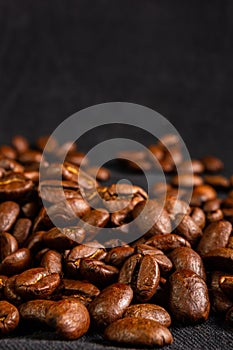 Natural background for Cafe menu or brochure template - macro photo of brown roasted coffee beans, close up